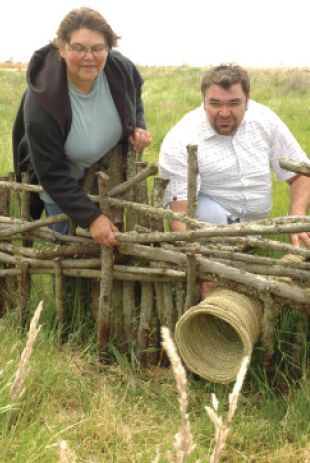 Top left: Figure 1 Eileen Alberts and Damein Bell at an eel trap, Tyrendarra Indigenous Protected Area, 2008 (Courtesy: Richard Cornish) [photograph]