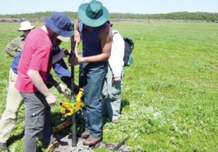 Figure 21 Monash University researchers removing a sediment core from the seasonally dry bed of Lake Condah for palaeoenvironmental reconstruction, 2005 (Courtesy: Peter Kershaw). [photograph]