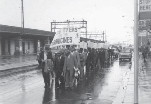 A journalist speaks to Pastor Doug Nicholls and Laurie Moffatt who led 40 Aboriginal protestors opposing Government plans to close Lake Tyers, Melbourne, May 1963 (Courtesy Ian Spalding) [photograph]